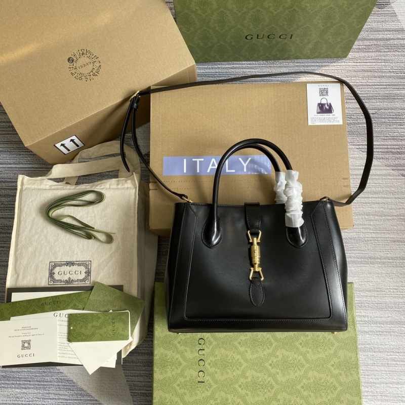 G*u*i top handle bags